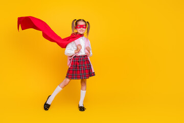 Full body photo of small schoolchild superhero costume uniform bag empty space isolated on yellow color background