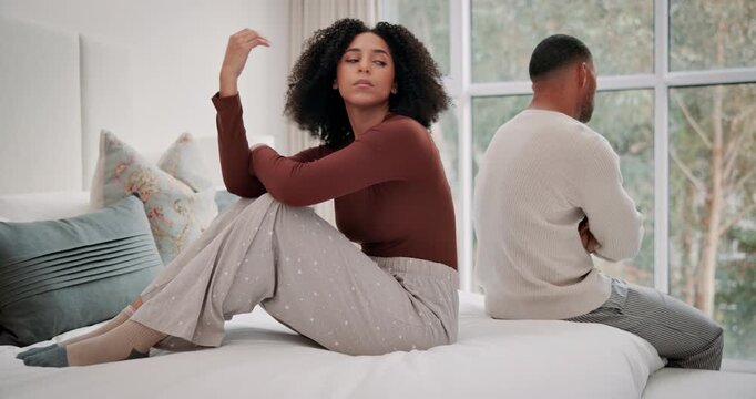Frustrated, couple and angry with fighting on bed for toxic marriage conflict, divorce and problem at home. Unhappy, people and stress with anxiety for miscommunication, argument and silent treatment