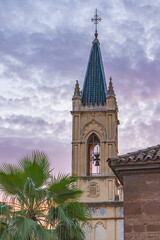 Bell tower of a Spanish church at sunset.