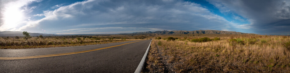 Perspective view of road across the mountainscape of San Clemente in Cordoba, Argentina