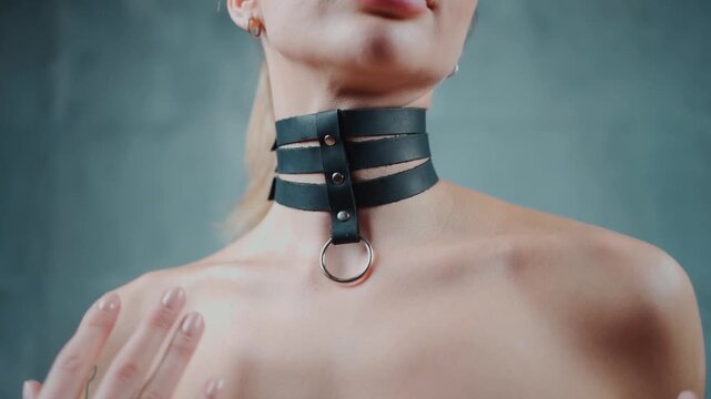 naked woman in black leather bdsm collar with metallic ring, nude female in seductive role playing game sexy choker