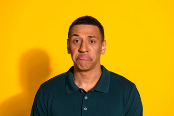 Portrait of nice young man sad face wear pullover isolated on vibrant yellow color background