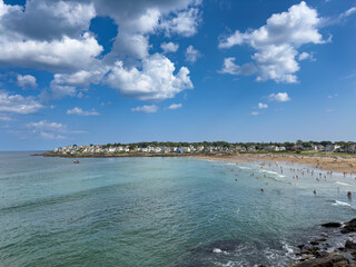 August vacationers enjoy a sunny Summer afternoon at York's Short Sands beach