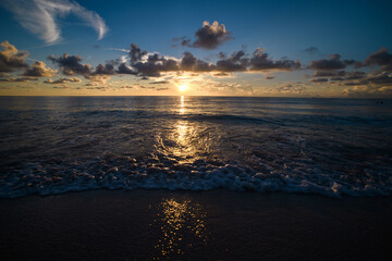 Sunset background. Ocean sundown sky for background. Sea waves for background or backdrop. Sun over sea. Ocean waves background. Sunset or sunrise.