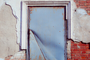 Textured brick wall for seamless background. Vintage design element. Copy space. Retro wallpaper. Use for display products. Window covered with steel sheet