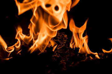 Fototapeta premium Fire flames on black background. Blaze fire flame texture. Fire flame with copy space. Blaze fire flame textured background. Flames on black background.