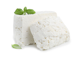 Fresh ricotta (cream cheese) and basil isolated on white