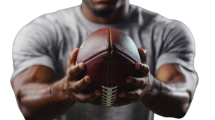 Football player in both hands holding ball on transparent background