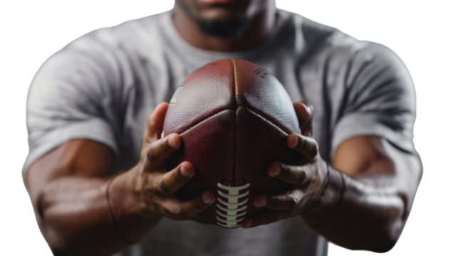 Football player in both hands holding ball on transparent background