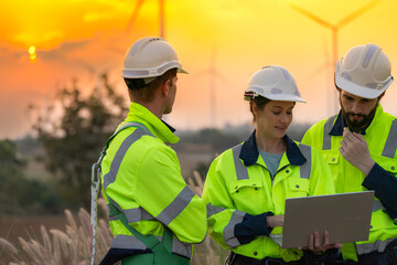 Team Engineers men and woman checking and inspecting on construction with sunset sky. people...