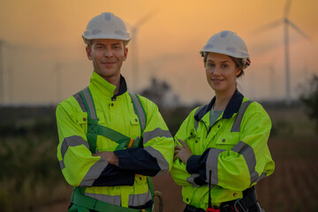 Team Engineers men and woman checking and inspecting on construction with sunset sky. people...