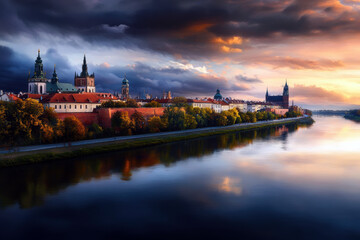 Obraz premium A city with a river running through it and a beautiful sunset in the background. The buildings are old and the sky is cloudy