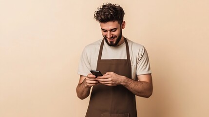 Full body young fun man barista barman employee wear brown apron work in coffee shop hold in hand use mobile cell phone isolated on plain pastel light beige background Small business s : Generative AI