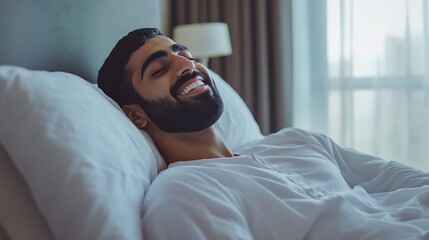 Obraz premium Morning Relax Smiling Pleased Arab Man Lying In Comfortable Bed After Waking Up Happy Millennial Middle Eastern Man Resting In Bedroom Enjoying Domestic Weekend Side View With Copy Spa : Generative AI