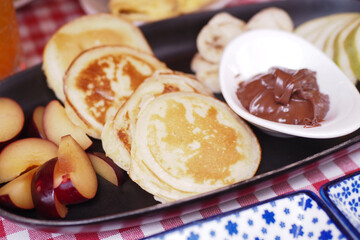 pan cake served with banana and strawberry 