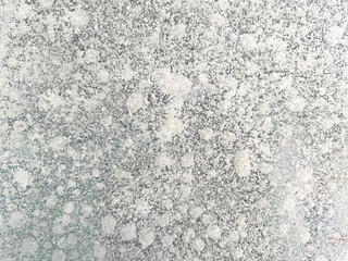Ice texture background. Textured cold frosty surface of ice block with frozen air bubbles.