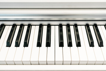Fototapeta premium Black and white keys on an electronic piano. Piano keys closeup. Classic piano keyboard.