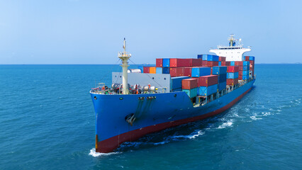 front view Cargo container ship carrying container and running in the ocean near international...