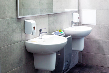 modern bathroom interior with a sink and a faucet in the toilet room