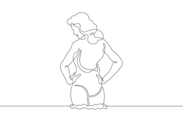 Beautiful woman standing in water. Girl in swimsuit entering sea. Vacation at resort.One continuous line. Line art. Minimum one line. White background. One line drawing.