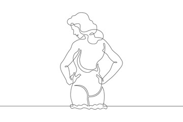 Beautiful woman standing in water. Girl in swimsuit entering sea. Vacation at resort.One continuous line. Line art. Minimum one line. White background. One line drawing.