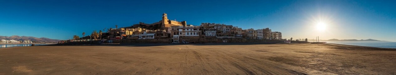 Stunning Backlit View of Santa Cruz Fort in Oran, Algeria: Dramatic Silhouette Against Ocean and City Skyline. Captivating Travel Destination for Unforgettable Vacations. AI-Generated 4K Wallpaper Sho