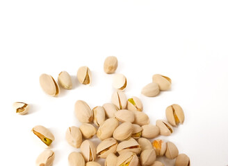 Salted roasted pistachios nuts top view in isolated white background. Or Kacang Fustuk usually use for Hajj gift.
