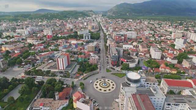 View of the central square Sheshi Demokracia with fountain and modern buildings, Albania, Southeast Europe. Also visible is the Migjeni theater.