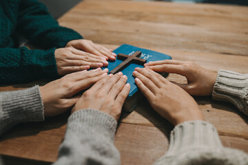 Christians are congregants join hands to pray and seek the blessings of God.