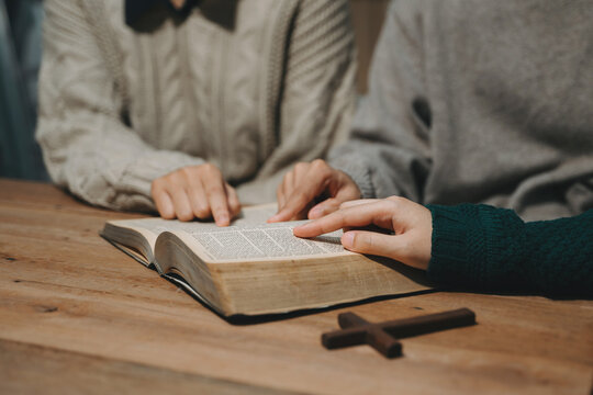 Christians are congregants join hands to pray and seek the blessings of God.