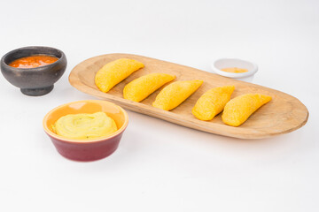 Colombian empanada with spicy sauce 