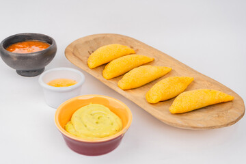 Delicious traditional Colombian empanadas with spicy sauce