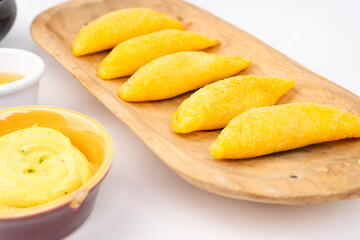 Colombian empanada with spicy sauce 