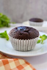 Coffee break chocolate cupcake on white background