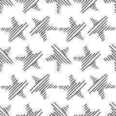 A seamless pattern of hand-drawn stars. Abstract repeating background