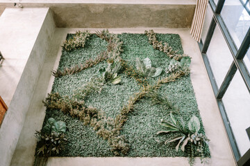 Wall decoration featuring artificial plants, adding a touch of greenery and style to the interior.
