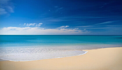 The wide sea and the sandy beach. Blue sky.