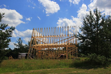 Roof construction of a wooden building. Wood frame residential building under construction