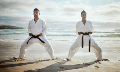 Ocean, martial arts and people training for fitness, workout and fight with master at lesson. Warrior, karate and team at beach for exercise, taekwondo and performance outdoor with student learning © Fanti/peopleimages.com