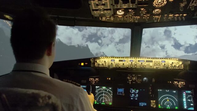 Adept aviator navigates aircraft with steering wheel looking at radars. Captain in uniform pushes thrust lever decreasing airspeed