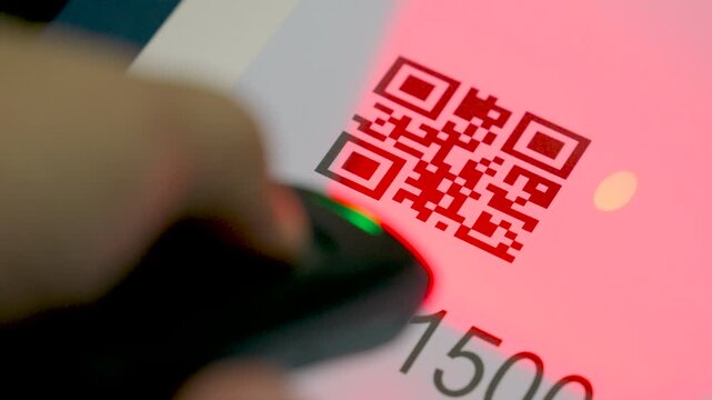 Close up wireless barcode reader to read barcode with red laser light to check the accuracy of barcode. Logistics, Import.