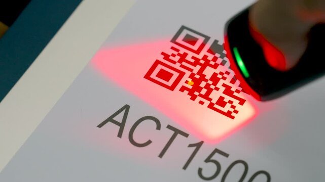Close up wireless barcode reader to read barcode with red laser light to check the accuracy of barcode. Logistics, Import.