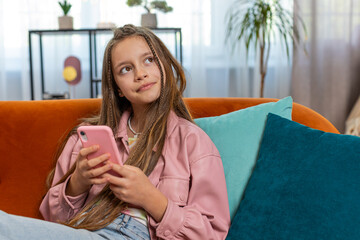 Young girl texting share messages content on smartphone social media applications online watching...