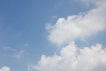 
Blue sky and white puffy clouds