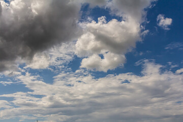 Fototapeta premium Ornamental clouds. Dramatic sky. Epic storm cloudscape Soft sunlight. Panoramic image texture background graphic resources design Meteorology, heaven hope peace concept