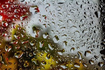 abstract background fall, glass drops autumn yellow leaves wet october weather