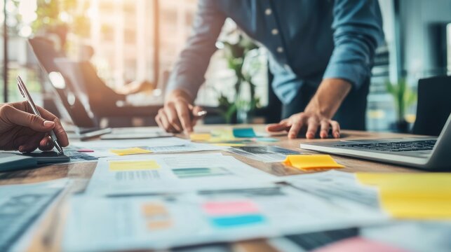 Entrepreneur sharing detailed business workflow insights with colleagues for operational excellence