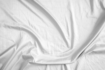 Naklejka premium Abstract white wrinkled bedding sheet fabric texture background