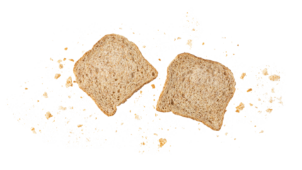 Cutting slices of wholegrain wheat bread with crumbs flying isolated on white background.
