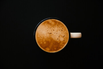 cup of coffee on black background